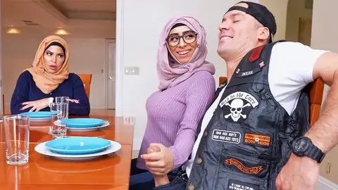 Hijab-wearing Lady Providing A Hand Job From Under The Table